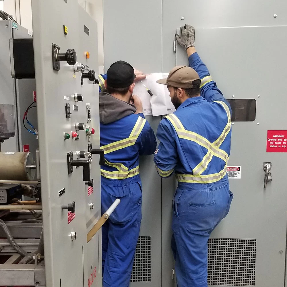 Electrical switchgear panel open during installation and maintenance in Alberta facility