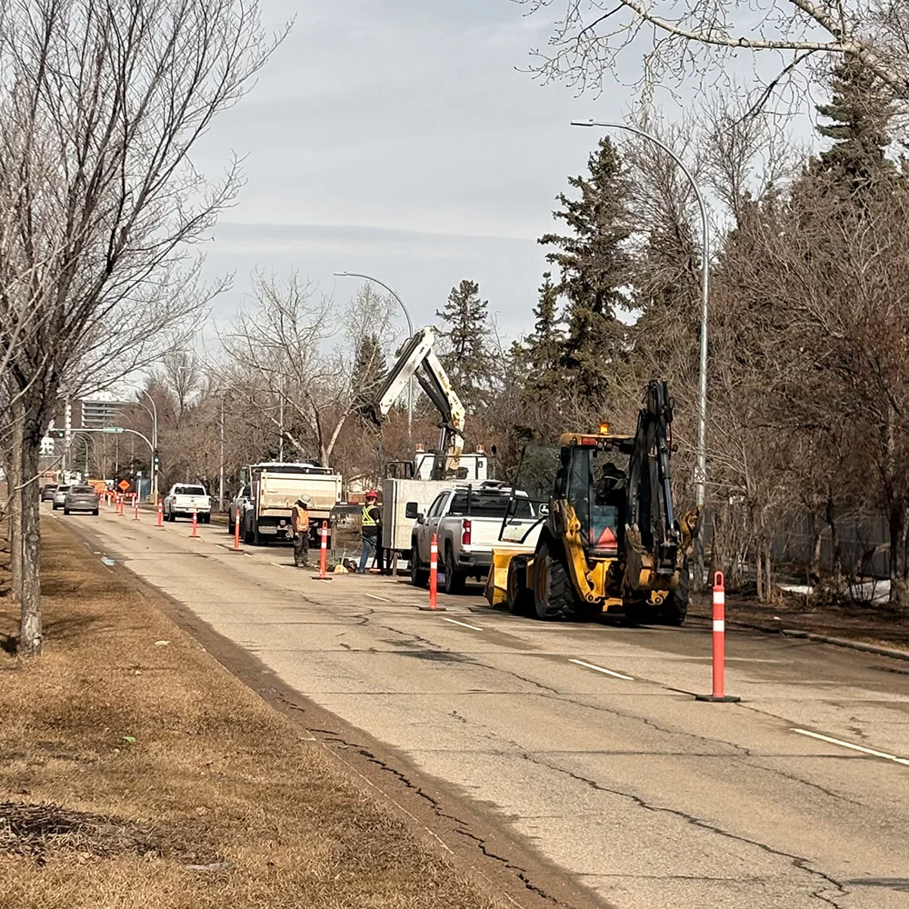 Fibre infrastructure deployment along roadway in Alberta with active construction crew