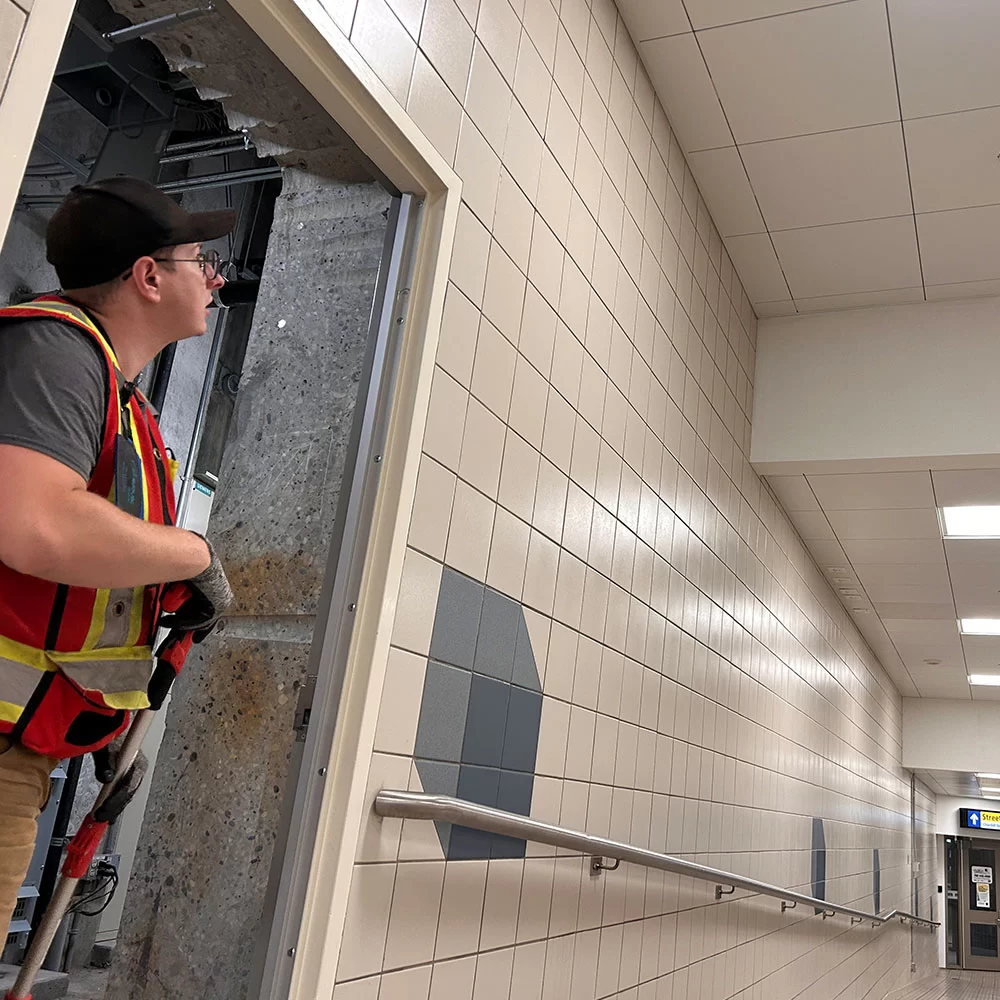Chermik technician performing infrastructure work inside commercial facility